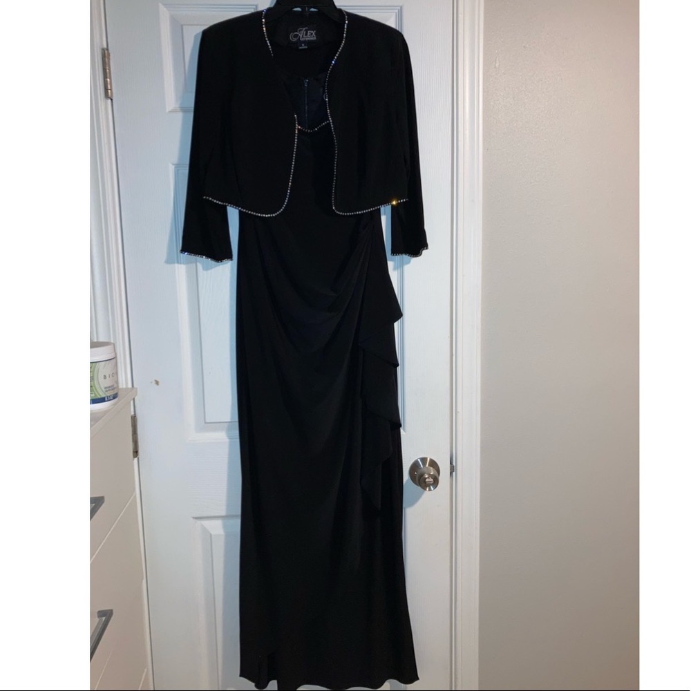 Long black dress with ruffles on the side. Jacket included with rhinestones
